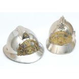 Two early 20th century French Fire Service polished steel and brass helmets: for 'D Eguisses' and