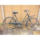 A mid 20th century BSA Shopper bicycle: green step through frame,chrome plated handlebars,