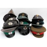 A collection of eleven various Russian & Eastern European military caps and hats: (a lot)