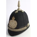 A Glamorgan Constabulary blue cloth helmet: of six panels with plated reeded finial and cross
