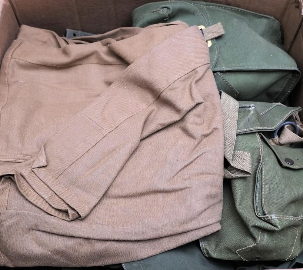 A collection of WWII and later canvas rucksacks,