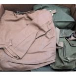 A collection of WWII and later canvas rucksacks,