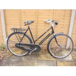 A 1950s Rudge Whitworth Sports bicycle: black step through frame with original decals,