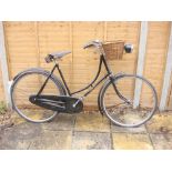A 1930s Humber Sports lady's bicycle: black step through frame with gilt lettering,