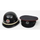 A mid 20th century London Fire Brigade black lacquer helmet by George Angus & Co: with single white