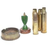 A collection of WWI No 101 fuses: together with a WWII trench art ashtray and a collection of shell