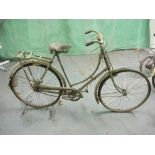 A Raleigh all steel bicycle: step through frame with frame mounted Sturmey Archer three speed gears,