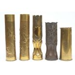 A pair of Trench Art vases: together with three others with stipple and repousse decoration,