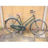 A Raleigh 'All Steel Model' lady's bicycle: the green step through frame with original decals,