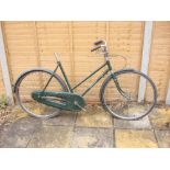 A Hercules 'Balmoral' lady's bicycle,: original green step through frame with decals,