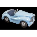An Austin J40 pedal car: light blue with dark blue upholstery and chrome trim,