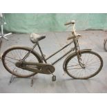 A Raleigh all steel bicycle: step through frame with frame mounted Sturmey Archer three speed gears,