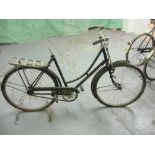 A Raleigh all steel bicycle: step through frame with plated handlebars, bar brakes,