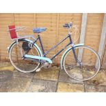 A 1960s BSA lady's bicycle: two tone blue step through frame, plated handlebars,