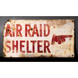 A WWII enamel 'Air Raid Shelter' sign: with pointing hand, red on white ground, 25.