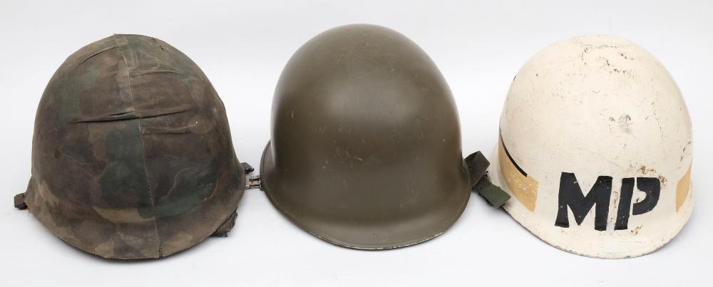 A post war period American M51 pattern Military Police steel helmet: over painted white with 'MP'