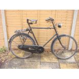 A 1920s Sunbeam bicycle: frame mounted Sturmey Archer three speed gears, bar brakes, leather saddle,