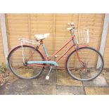A BSA Bermuda lady's bicycle: red and blue step through frame,