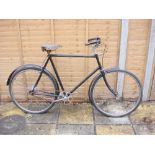 A 1950s Gazelle gentleman's bicycle: black frame with plated bars and crank, three speed rear hub,