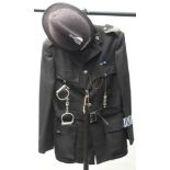 A 20th century police tunic with Northumbria Police helmet: together with handcuffs,