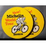 Two Michelin 'New World Tour' double sided cardboard bicycle advertising signs: depicting Bibendum