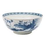 A First Period Worcester blue and white bowl: painted in 'The Precipice' pattern of buildings and a
