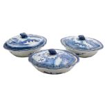 A group of three Chinese blue and white shaped oval vegetable tureens and matched covers: with