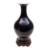 A Chinese mirror-black glazed vase and a celadon glazed vase: the first of baluster form with