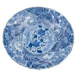 A large Chinese blue and white 'pheonix and monkey' charger: of spiral moulded form,