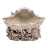 A Pymouth [William Cookworthy] shell salt: the shell resting on a rocky base applied with coral,
