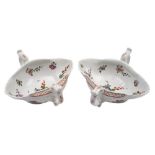 A fine pair of early Worcester two-handled double-lipped sauceboats: of silver form,