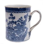 A Chinese blue and white mug: of cylindrical form with plaited handle and leafy terminals,