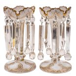 A pair of Bohemian white and clear overlay glass lustres: of traditional foliate design embellished
