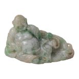 A Chinese jadeite carving of Hotei: of pale celadon and spinach flecked colour wearing loose robes