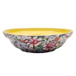 A Chinese millefleur yellow ground famille noire shallow bowl: of ogee form,