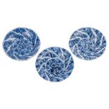 A matched set of three Chinese blue and white spiral moulded deep dishes: each painted overall with