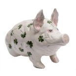 A large Bovey Tracey Weymss pig: modelled in seated position and decorated with shamrock,