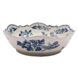 A First Period Worcester blue and white junket/salad bowl: with shaped rim and moulded with shells,