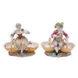 A pair of Meissen figural sweetmeat dishes and a similar pair: each pair modelled as a boy and girl