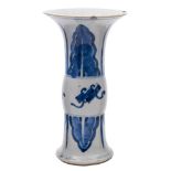 A Chinese blue and white Gu-form beaker vase: painted with auspicious objects and lappets,