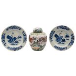 A Chinese famille verte jar and cover and a pair of blue and white plates: the first painted with