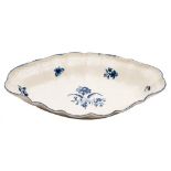 A First Period Worcester blue and white oval dish: the scallop shaped rim with basket weave border,