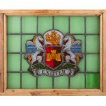 A stained glass panel bearing the Exeter City Coat-of-Arms: to a green ground and contained in a
