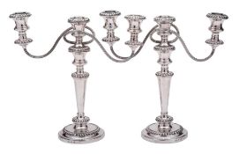 A pair of silver plated twin branch candelabra,