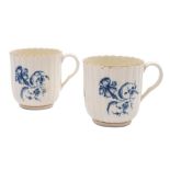 A pair of First Period Worcester blue and white coffee coffee cups and a sparrow beak cream jug: