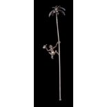 A Continental silver novelty swizzle stick: modelled as a monkey climbing a palm tree to collect