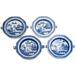 A group of four Chinese blue and white warming dishes: each painted with a pagoda lake landscape