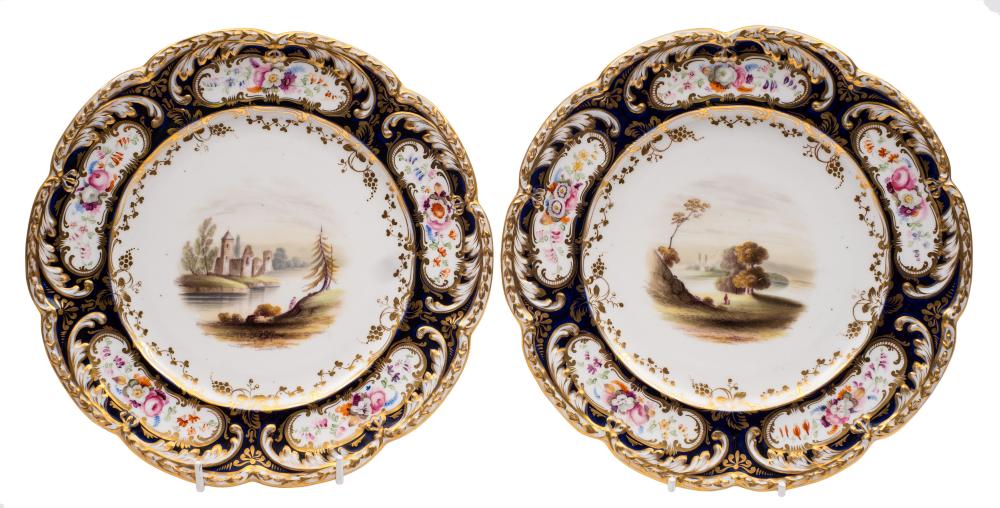 A pair of 19th Century English porcelain dessert plates: the centres painted with lake and