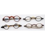 Four pairs of tortoiseshell and white metal spectacles: all having tortoiseshell mounted lenses