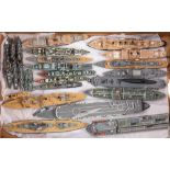 A group of twenty-six scratch built wooden waterline scale models of Royal Navy ships by Tony